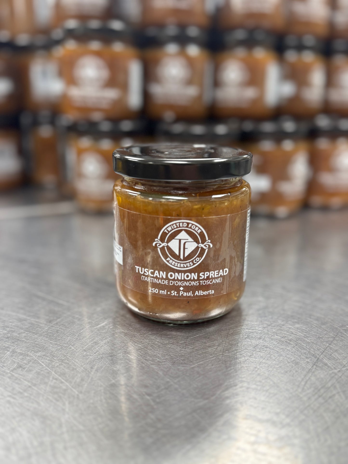 OUr Tuscan Onion Spread shown in front of production