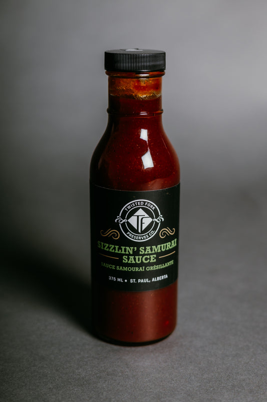 Bottle of Sizzlin' Samurai sauce on a gray background